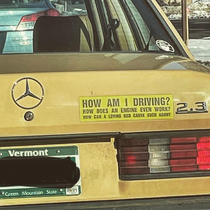 Existentialist bumper sticker from Vermont on an old yellow Mercedes