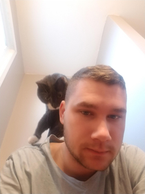 Follows me into my office and sits on my back