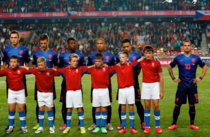 Footballer refuses to stand behind tall ball boy