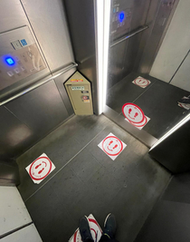 Four people can socially distance in this elevator if one person stands on the mirror