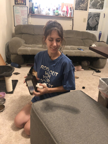 gf was cleaning a kitten accident and I noticed it looked like a extra irony we noticed after was the shirt she had just slept in