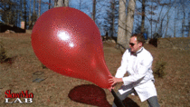 Giant balloon popping in slow motion
