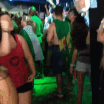 Girl signs the lyrics of trance to her deaf friend at the Tomorrowworld Music Festival