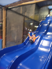 got a pic of my nephew trying out the slide that I PROMISED wouldnt be scary
