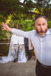 got our wedding pictures back today my dad photobombing us is definitely my favorite