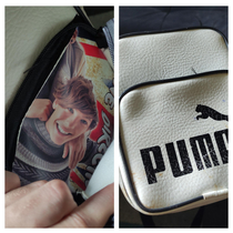 Got this cheap bootleg Puma bag as a gift  years ago Just discovered it has a random hidden Louis Tomlinson print inside one of the pouches for no apparent reason