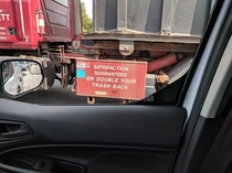 Great company slogan on a trash truck