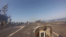 Green Shirts On The Deck Of A Carrier Have A Terrifying Job