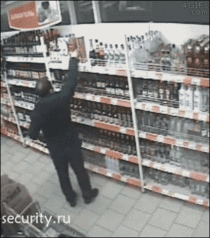 Guy tries to steal bottles of wine