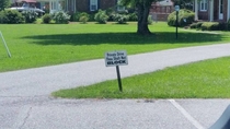 Guys driveway merges with a church parking lot love the sign