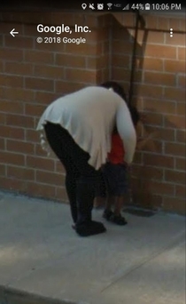 I found this picture of a kid who just pissed on the side of a building while Google Earthing where Mens Warehouse was