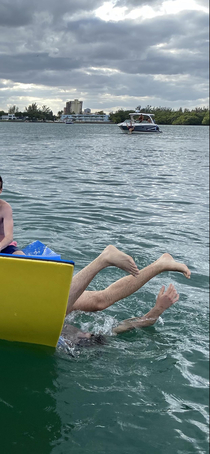 I got a pic of my bf falling off a floaty and just realized there was a guy falling off a boat at the same time