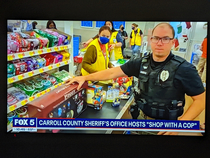 I guess the kid picked the Piggy present but why did the cop decide to pose with it