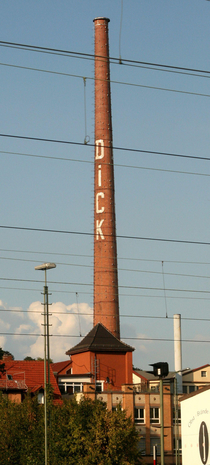 I live in Germany And in a town here there is a company with a special name This company came up with the great idea to write their name on a chimney This is the result