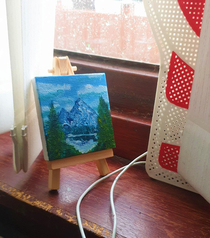 I received a tiny baby canvas and easel for Christmas and though the only appropriate thing to paint was bob ross