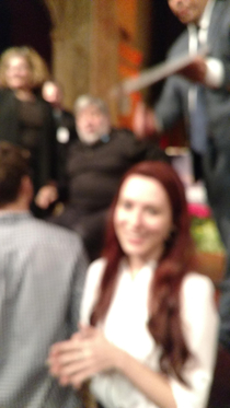 I saw Steve Wozniak speak and asked a coworker to take my picture in front of him Dude couldnt even focus