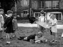 i saw this image floating around the internet with the caption children playing with a toy guillotine france 