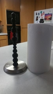 I see your bottle opener and I raise you my paper towel holder