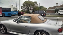 I think his car is almost too small for that pizza