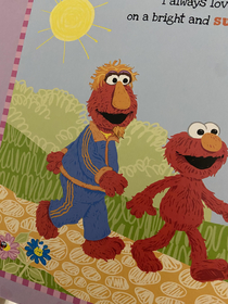 I was reading Elmo to my daughter before bedjust look at Elmos dad Dudes got a goatee and a track suit looking like he sells stereos out of the back of a car