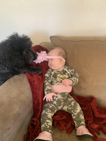 I was taking pictures of my baby girl and along came our puppy