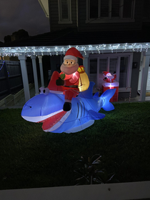 In Australia Santa delivers presents on a shark 