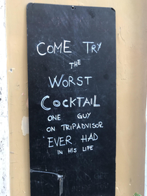 In front of a bar
