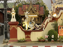In front of a Buddhist temple in Chiangmai Mai Thailand Someones enjoying themselves