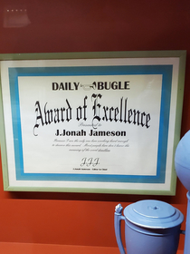 In line at the Amazing Spiderman ride at Universal Studios you can see awards of excellence for J Jonah Jameson awarded by J Jonah Jameson