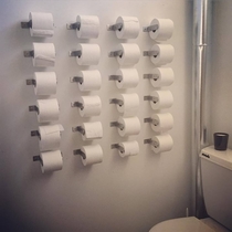 Instead of installing shelves in his office bathroom my friend went for a different approach