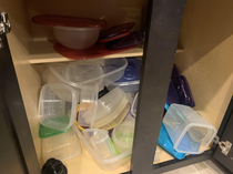 Is it a law of nature that every Tupperware cabinet must look like this