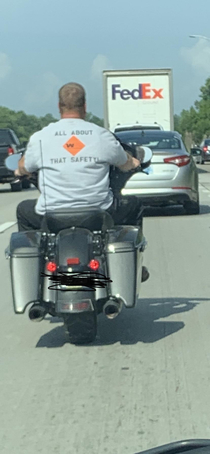 Is this shirt being worn ironically since he doesnt have a helmet