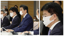 Japanese media keep focusing on PM Abes small mask yet theres this guy beside him