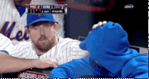 John Buck comforting Matt Harvey after learning that Harvey will be shut down for the season and may need Tommy John surgery 