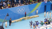 Katie Ledecky at her medal ceremony    waiting for her opponents to finish the race