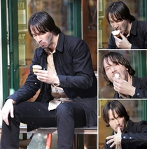 Keanu Reeves eating a cupcake