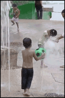 Kid balances ball on fountain