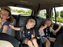 Kids first time hearing Bohemian Rhapsody air guitars abound