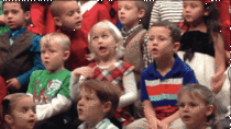Kindergartner uses sign language at her Holiday Concert for her two deaf parents