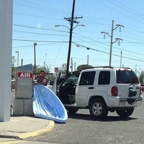 Lady at  inflating her pool