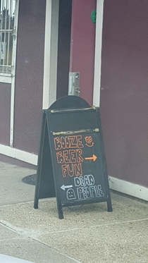 Local bar across from a cemetery