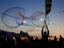 Local festival had people making massive bubbles I cant figure out why this one stood out to me