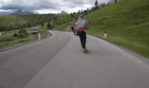 Longboarder slows down to overtake cyclists