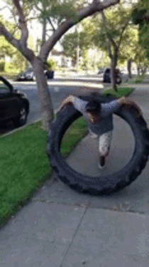 Man uses  pound tire as a hula hoop