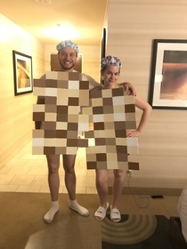 Me and my husband in our Halloween costumes as pixelated naked people