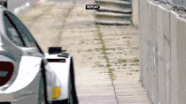 Mercedes DTM Car Gracefully Skimming a Concrete Barricade
