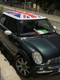 Milan Italy Euro Finals Mini Cooper with English livery on the hood prints Italian flag so fans dont destroy the car