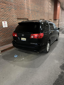 Minivan Hearse parked outside hospital morgue