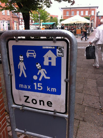 Mr Ts playing football in a sign in Denmark