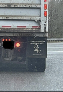 Mudflap company initials looks like a person taking a high velocity poo that bounces off the ground a few times initials are OSW